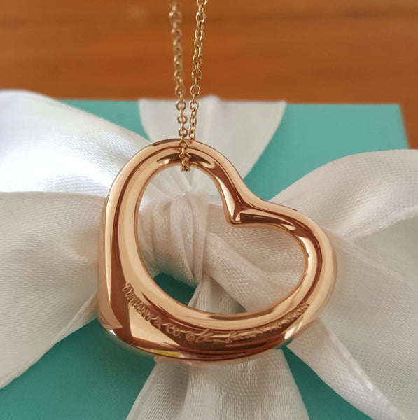 Vintage Tiffany & Co. Diamond Heart Pendant in 18ct Rose Gold. This shows the back of the Pendant with the Tiffany & Co. Hallmark. This Pre-Loved Necklace is Cheaper than Retail. Save Significantly. 
