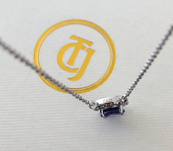 0.90ct Tanzanite and 0.06tcw Diamond Pendant in 14ct White Gold