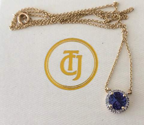 0.90ct Tanzanite and 0.06tcw Embrace Diamond Pendant in 14ct Yellow Gold CTJ